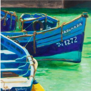 Three boats, in the clear green water of a harbour