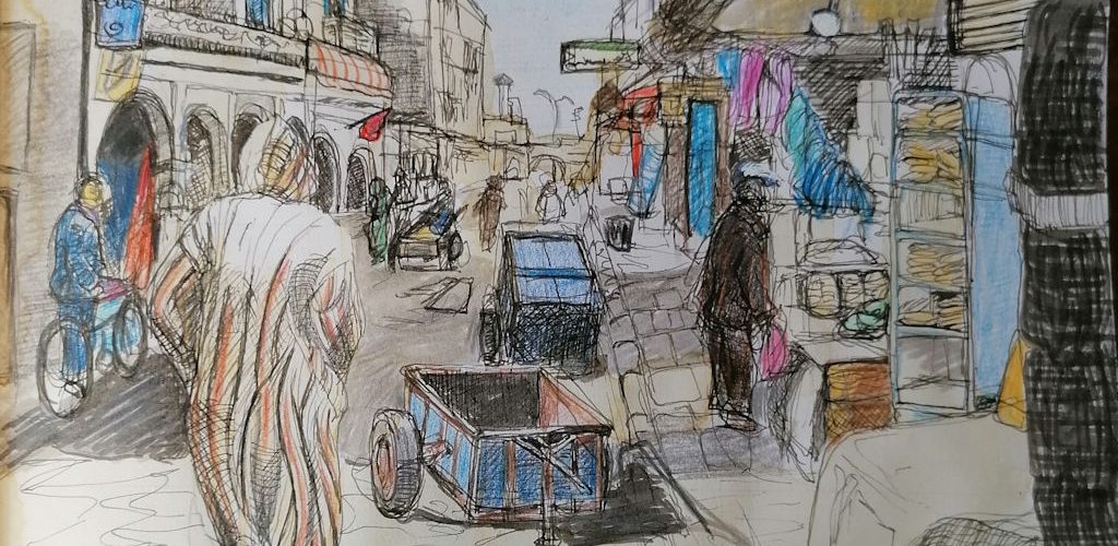 Market Street March 2020 A man in a djellaba walks away from the viewer